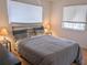 Cozy bedroom with a double bed, nightstands, and window blinds at 5925 Todd St # D-21, Bradenton, FL 34207