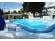Relaxing kidney-shaped pool with plenty of deck space for sunbathing at 5925 Todd St # D-21, Bradenton, FL 34207