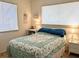Bedroom with double bed, nightstands, and window coverings at 5925 Todd St # D-21, Bradenton, FL 34207