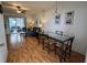 Bright living room with hardwood floors and dining area at 5925 Todd St # D-21, Bradenton, FL 34207