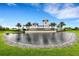 Impressive community entrance with water feature and landscaping at 14480 Eagle Branch Dr, Nokomis, FL 34275