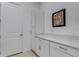 Laundry room with white cabinets and Maytag washer and dryer at 14480 Eagle Branch Dr, Nokomis, FL 34275