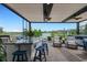 Relaxing covered patio with outdoor kitchen and seating area at 14480 Eagle Branch Dr, Nokomis, FL 34275