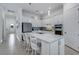 Modern kitchen with island, stainless steel appliances, and white cabinetry at 14480 Eagle Branch Dr, Nokomis, FL 34275