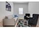 Cozy sitting room with a light grey sofa, two armchairs, and a decorative rug at 14480 Eagle Branch Dr, Nokomis, FL 34275