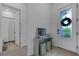 Entryway with a full-length mirror and view of bathroom at 14480 Eagle Branch Dr, Nokomis, FL 34275