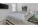 Bedroom with white dresser and floral bedding at 14480 Eagle Branch Dr, Nokomis, FL 34275
