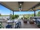 Spacious patio with an outdoor kitchen, seating, and hot tub at 14480 Eagle Branch Dr, Nokomis, FL 34275