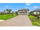New home with attached garage and landscaped yard at 3118 Tramonto Ct, Bradenton, FL 34211