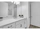 Bright bathroom with a single sink, quartz counters, and a separate tiled shower enclosure at 11746 Little River Way, Parrish, FL 34219