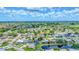 Expansive aerial view showcasing a residential community with lush greenery, serene ponds, and beautiful homes at 5306 19Th W Ave, Bradenton, FL 34209