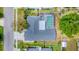 Aerial view of property with pool, patio, fenced yard, driveway and tree-lined street at 5306 19Th W Ave, Bradenton, FL 34209