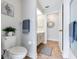 Cozy bathroom showcases a toilet, towel rack, vanity, and decorative mirror, offering a functional and stylish space at 5306 19Th W Ave, Bradenton, FL 34209