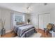 Cozy bedroom with hardwood floors, ceiling fan, and ample natural light at 5306 19Th W Ave, Bradenton, FL 34209