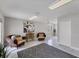 Spacious bonus room with tile flooring, ceiling fan, and casual seating, perfect for relaxation and entertainment at 5306 19Th W Ave, Bradenton, FL 34209