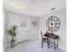 Inviting entryway with a decorative clock, desk, and potted plant, creating a welcoming atmosphere at 5306 19Th W Ave, Bradenton, FL 34209