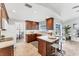 Kitchen featuring wood cabinetry, white countertops, stainless steel appliances and a peninsula with seating at 5306 19Th W Ave, Bradenton, FL 34209