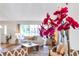 Bright living room featuring comfortable seating and view through the window, accented by a vibrant orchid at 5306 19Th W Ave, Bradenton, FL 34209