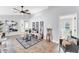 Spacious, naturally lit living room features stylish decor, tile floor, and access to other rooms at 5306 19Th W Ave, Bradenton, FL 34209
