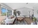 Bright living room boasts large windows, stylish furniture, hardwood floors, and elegant decor at 5306 19Th W Ave, Bradenton, FL 34209