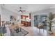Open-concept living area with kitchen, ceiling fan, and access to a screened patio at 5306 19Th W Ave, Bradenton, FL 34209
