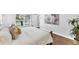 Bright bedroom highlighting backyard pool access and hard wood flooring at 5306 19Th W Ave, Bradenton, FL 34209