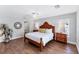Spacious bedroom features wood floors, ceiling fan, and ensuite bathroom at 5306 19Th W Ave, Bradenton, FL 34209