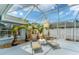 Relaxing screened patio with palm trees, lounge chairs, and pebble landscaping at 5306 19Th W Ave, Bradenton, FL 34209