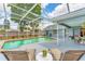 Large screened pool area with lounge chairs, well-maintained landscaping, and ample patio space at 5306 19Th W Ave, Bradenton, FL 34209