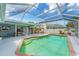 Expansive screened pool area with lounge chairs, dining space, and outdoor entertaining options at 5306 19Th W Ave, Bradenton, FL 34209