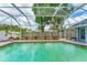 Spacious screened pool area with lush garden views and a well-maintained pool at 5306 19Th W Ave, Bradenton, FL 34209