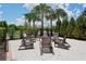 Relaxing fire pit area with seating for outdoor gatherings at 220 Capriana Ct, Nokomis, FL 34275
