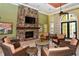 Cozy clubhouse with fireplace and comfortable seating at 220 Capriana Ct, Nokomis, FL 34275