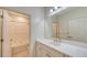 Clean bathroom with single vanity, bathtub, and tiled shower at 220 Capriana Ct, Nokomis, FL 34275