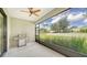 Spacious screened patio with built-in grill and backyard access at 220 Capriana Ct, Nokomis, FL 34275