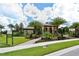 Elegant community clubhouse with landscaping at 220 Capriana Ct, Nokomis, FL 34275