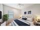 Bright bedroom featuring a comfortable bed and stylish decor at 220 Capriana Ct, Nokomis, FL 34275