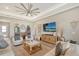 Spacious living area with comfortable seating and a large screen TV at 9018 Sunray Cv, Parrish, FL 34219