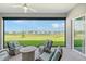 Covered lanai overlooking a pond, perfect for relaxing at 9018 Sunray Cv, Parrish, FL 34219