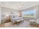 Spacious primary bedroom with large windows and sitting area at 9018 Sunray Cv, Parrish, FL 34219