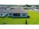 Aerial view of home with backyard and patio at 9018 Sunray Cv, Parrish, FL 34219