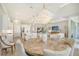 Open concept dining room with a round table, and access to kitchen and Gathering room at 9018 Sunray Cv, Parrish, FL 34219