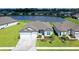 One-story home with gray siding, two car garage and paver driveway at 9018 Sunray Cv, Parrish, FL 34219