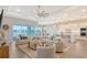 Spacious living room with open floor plan and water view at 9018 Sunray Cv, Parrish, FL 34219