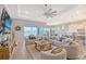 Open concept living area with neutral decor and water view at 9018 Sunray Cv, Parrish, FL 34219