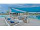 Relaxing pool area with lounge chairs and shade structures at 9018 Sunray Cv, Parrish, FL 34219