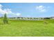 Large backyard with pond and community views at 9018 Sunray Cv, Parrish, FL 34219