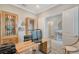 Functional home office with a desk, built-in storage and a view to hallway at 9018 Sunray Cv, Parrish, FL 34219