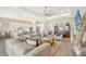 Open living space with neutral decor, and kitchen view at 9018 Sunray Cv, Parrish, FL 34219