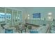 Comfortable clubhouse lounge with a TV, fireplace and access to outdoor patio at 9018 Sunray Cv, Parrish, FL 34219